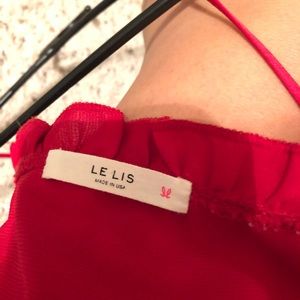 Stella Rae’s Tops - Red tank with frilly trim. Stella Rae’s Tops - Red tank with frilly trim.